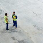 Building coworkers discussing construction