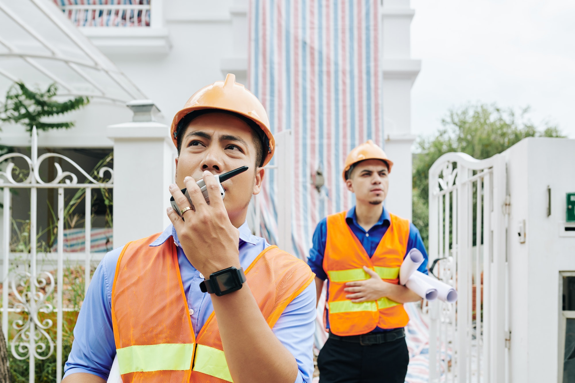 Construction workers leaving building