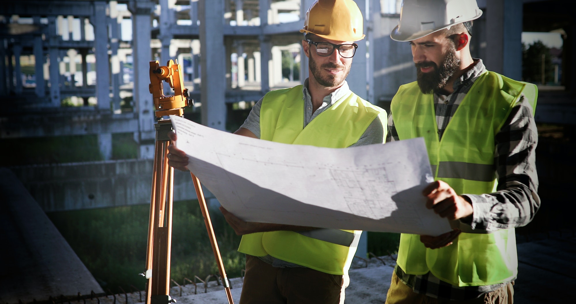 Portrait of construction engineers working on building site